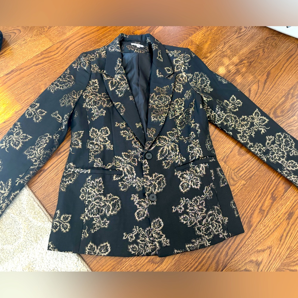 Black oversized blazer (to me - I’m a size 2).  Gold sparkle accents.